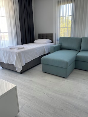 Family Apartment | Living area | 32-inch LCD TV with satellite channels, TV - Cicek Apart Hotel (Cesme)