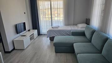 Family Apartment | Living area | 32-inch LCD TV with satellite channels, TV