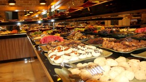 A buffet with various food items and utensils. - Nun Otel (Konya)