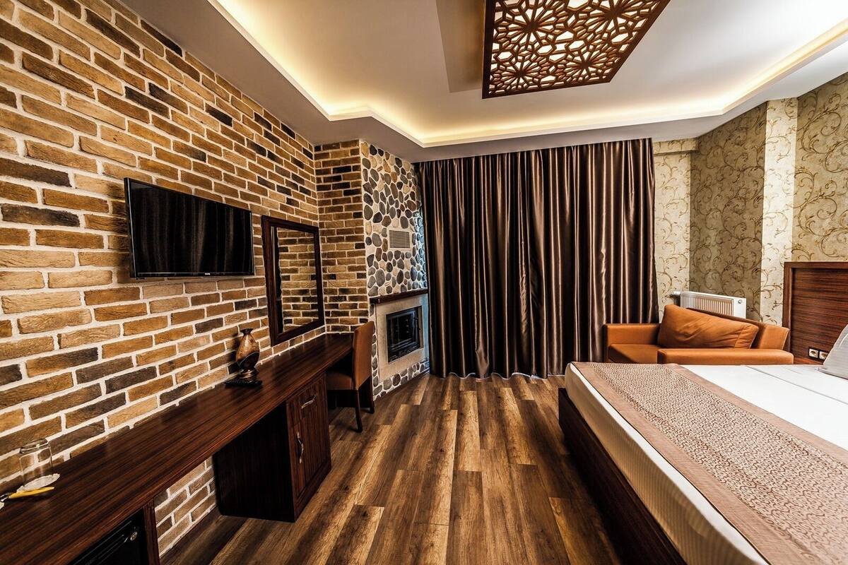 Deluxe kamer, open haard, uitzicht op meer | Uitzicht op het meer
