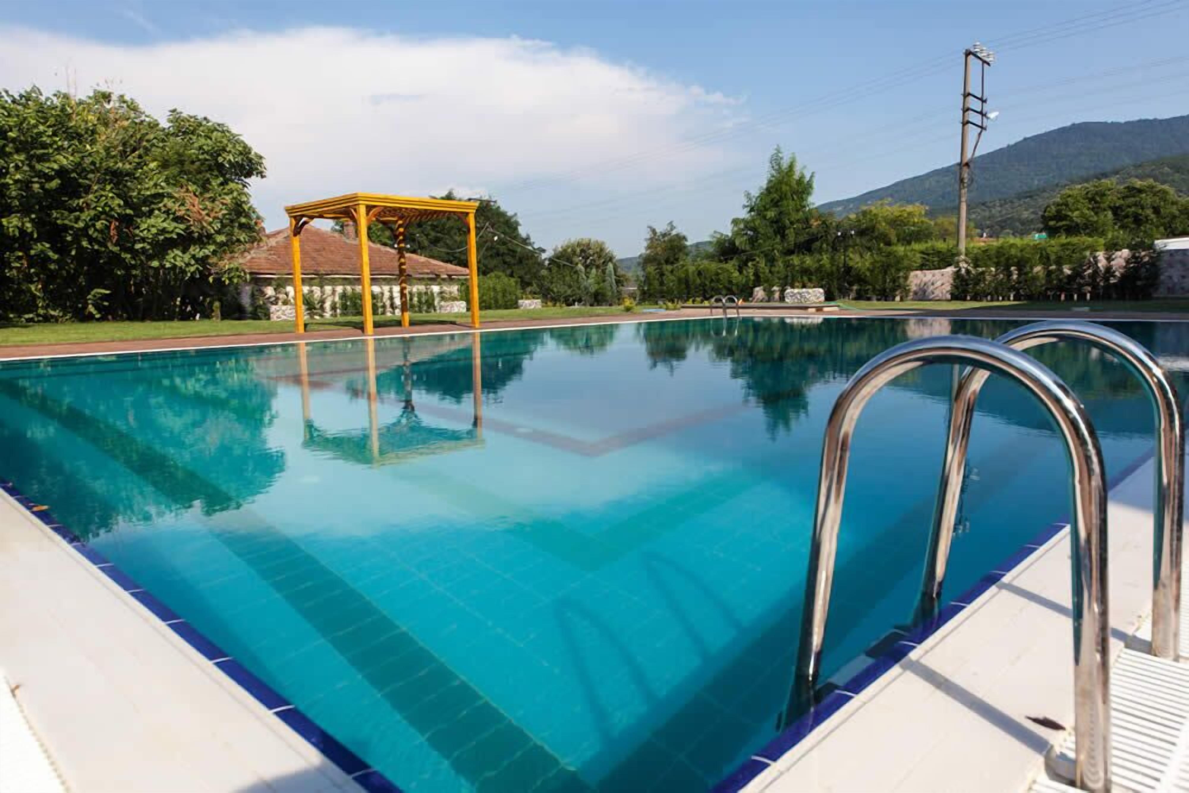 outdoor pool, pool umbrellas, pool loungers