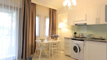 Apartment | Private kitchenette | Full-size fridge, stovetop, dishwasher, coffee/tea maker