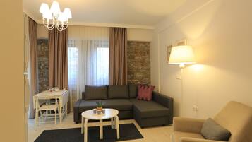 Apartment, Garden View | Living area | LED TV