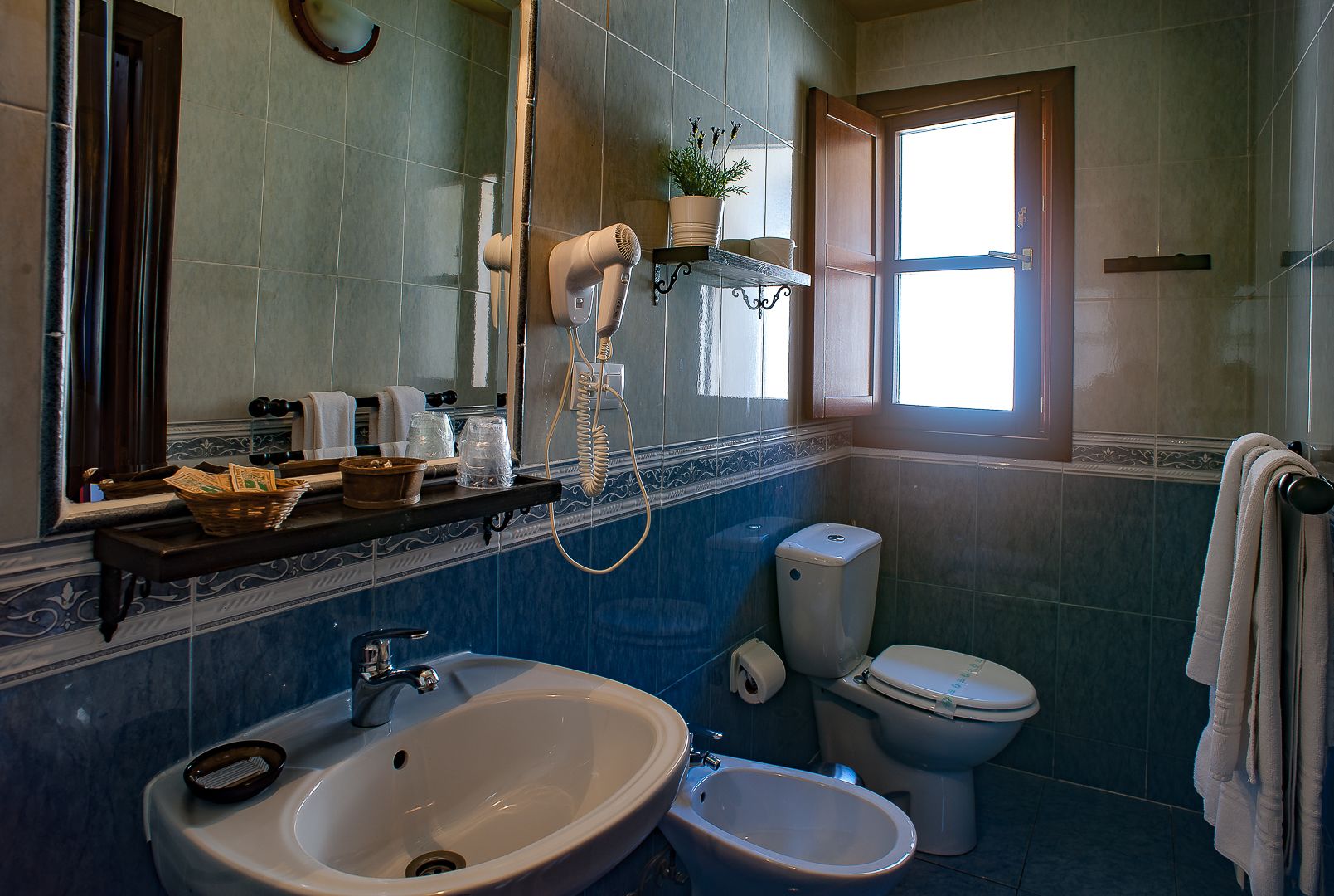 bathtub, free toiletries, hair dryer, towels