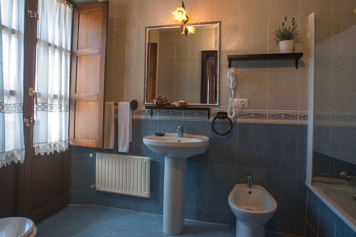 bathtub, free toiletries, hair dryer, towels