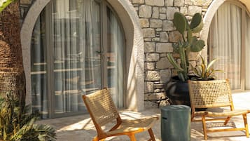 Deluxe Room, Patio, Garden View | Memory foam beds, minibar, in-room safe, individually decorated