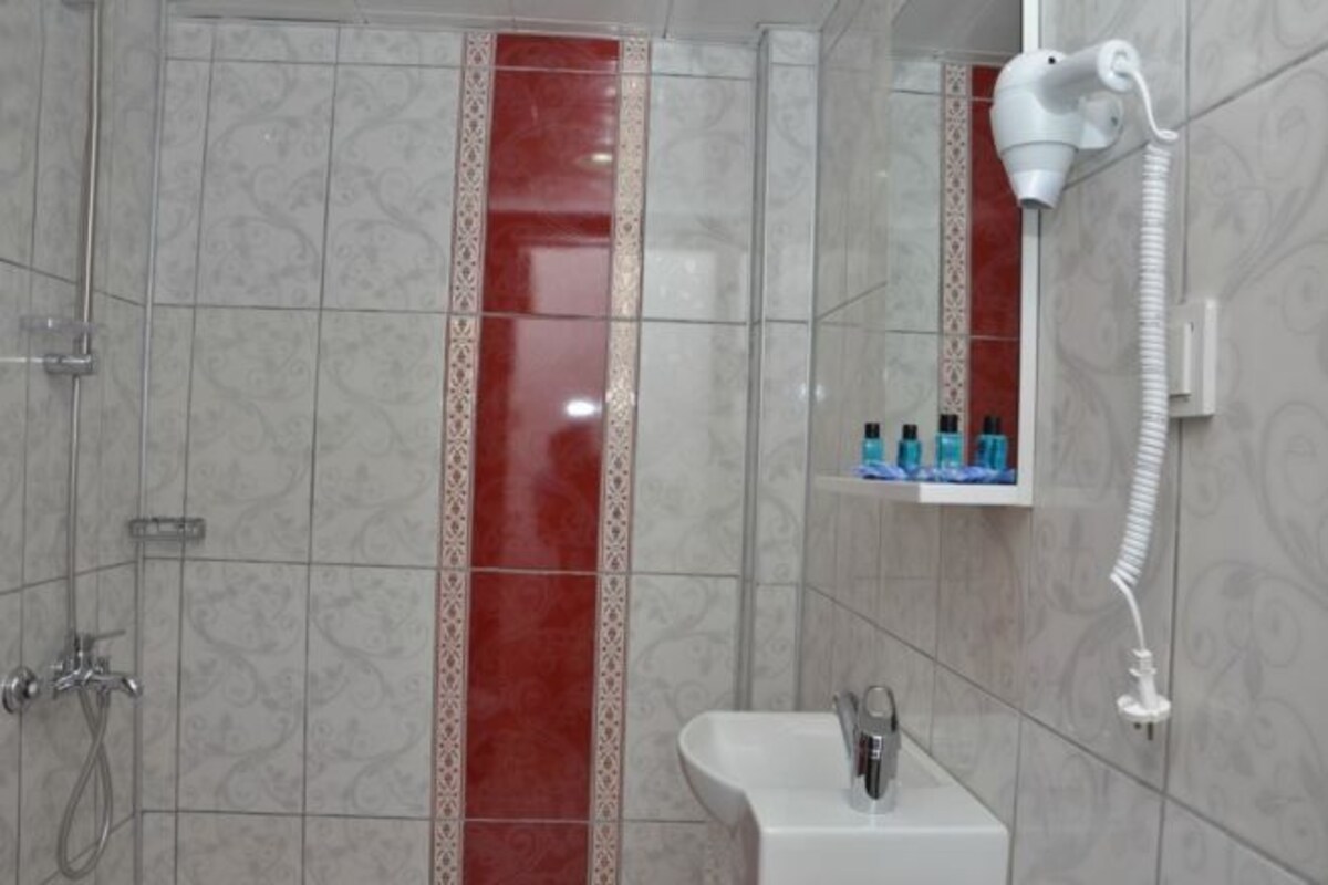 Bathroom | Shower, free toiletries, hair dryer, slippers