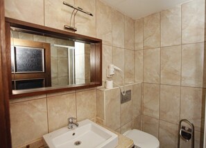 Shower, free toiletries, hair dryer, slippers
