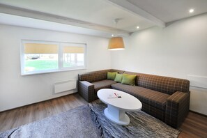 Luxury Cottage, 2 Bedrooms, Kitchenette, Courtyard Area | Living area | Flat-screen TV