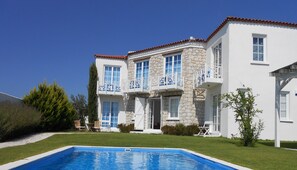 Seasonal outdoor pool, pool loungers