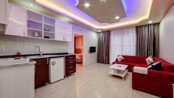 Standard Suite, 1 Bedroom, Kitchen | Living area | 32-inch LED TV with satellite channels, TV