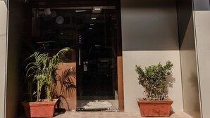 The entrance to a building with a sign reading "AWESOME DORMITORY" and the letters "AD" above it. - Awesome Dormitory (Mumbai)