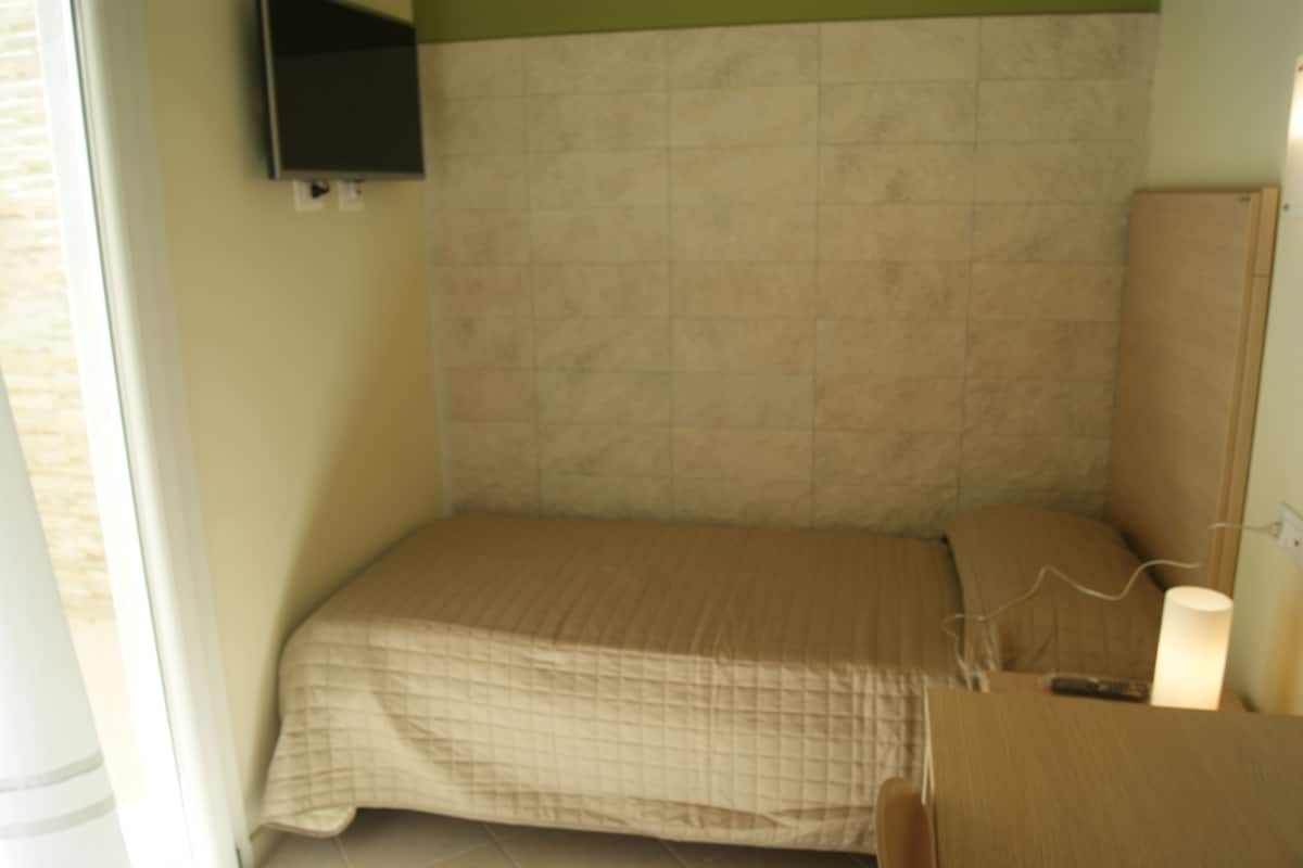 Basic Single Room, Ground Floor | Down duvets, minibar, desk, blackout curtains
