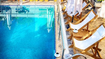 Outdoor pool, pool umbrellas, pool loungers