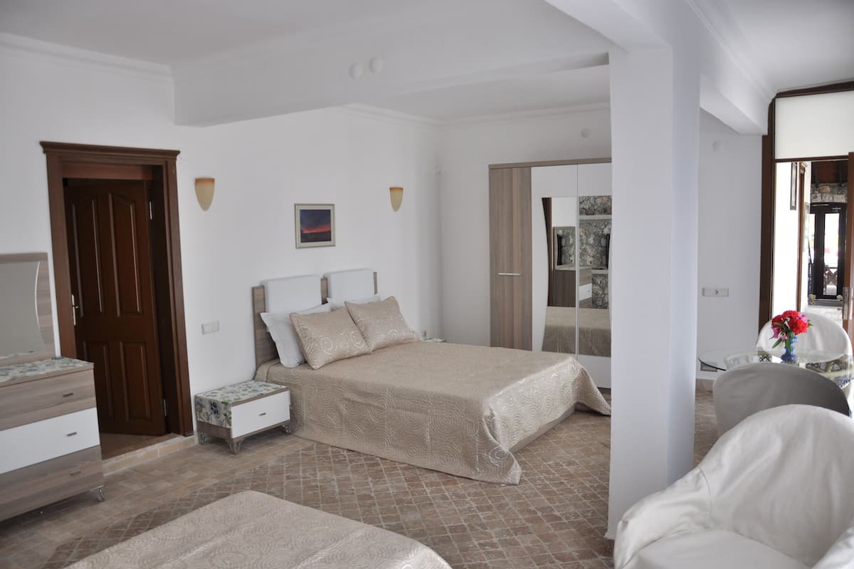 Standard Triple Room, Partial Sea View | Premium bedding, in-room safe, iron/ironing board, bed sheets