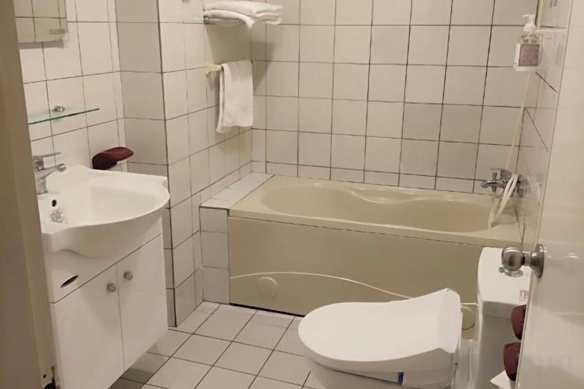 Bathroom | Combined shower/bathtub, free toiletries, hair dryer, slippers