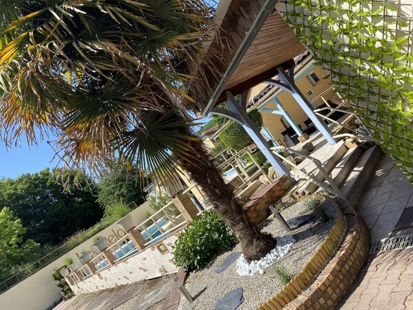 Seasonal outdoor pool, open 9:00 AM to 8:00 PM, pool loungers