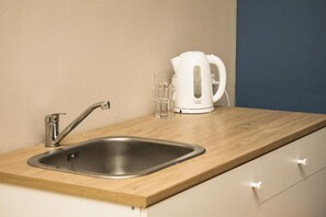 Microwave, stovetop, coffee/tea maker, electric kettle