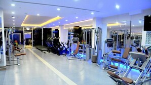 A modern gym with cardio equipment, weight machines, and a clean, well-lit interior. - Ozpark Hotel (Aksehir)