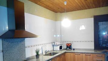 Apartment, 1 Bedroom | Private kitchen | Full-size fridge, microwave, stovetop, dishwasher