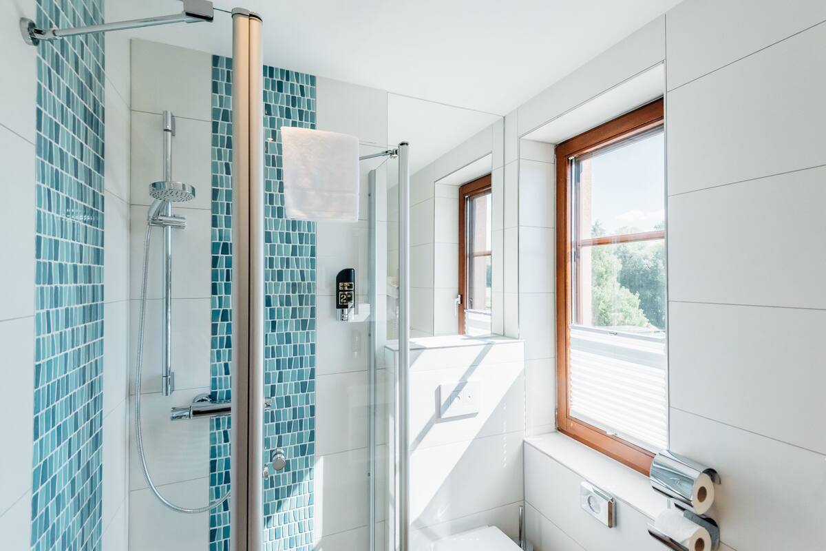 studio | bathroom | hair dryer, towels, soap, toilet paper