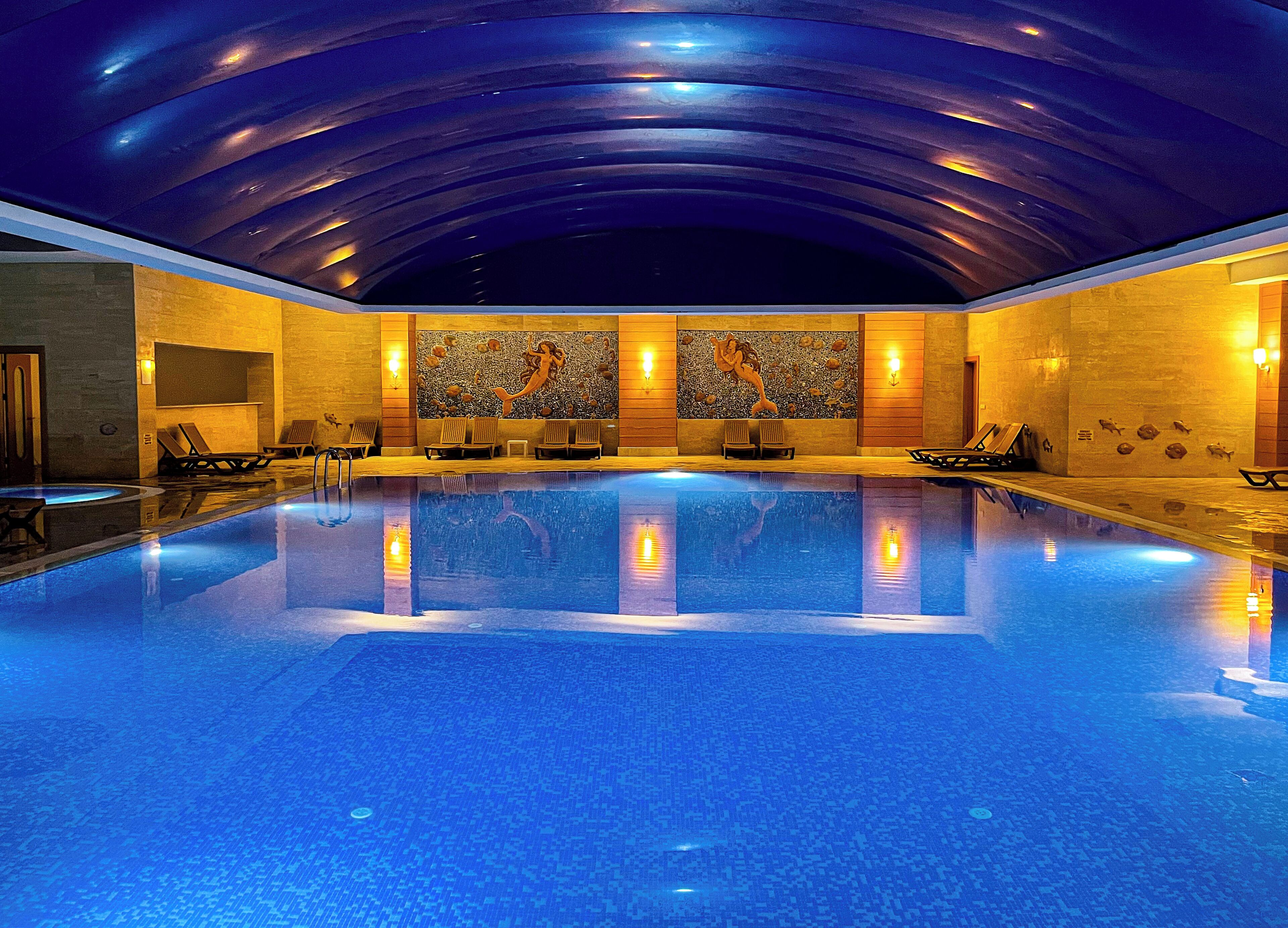 Indoor pool, outdoor pool, pool umbrellas, sun loungers