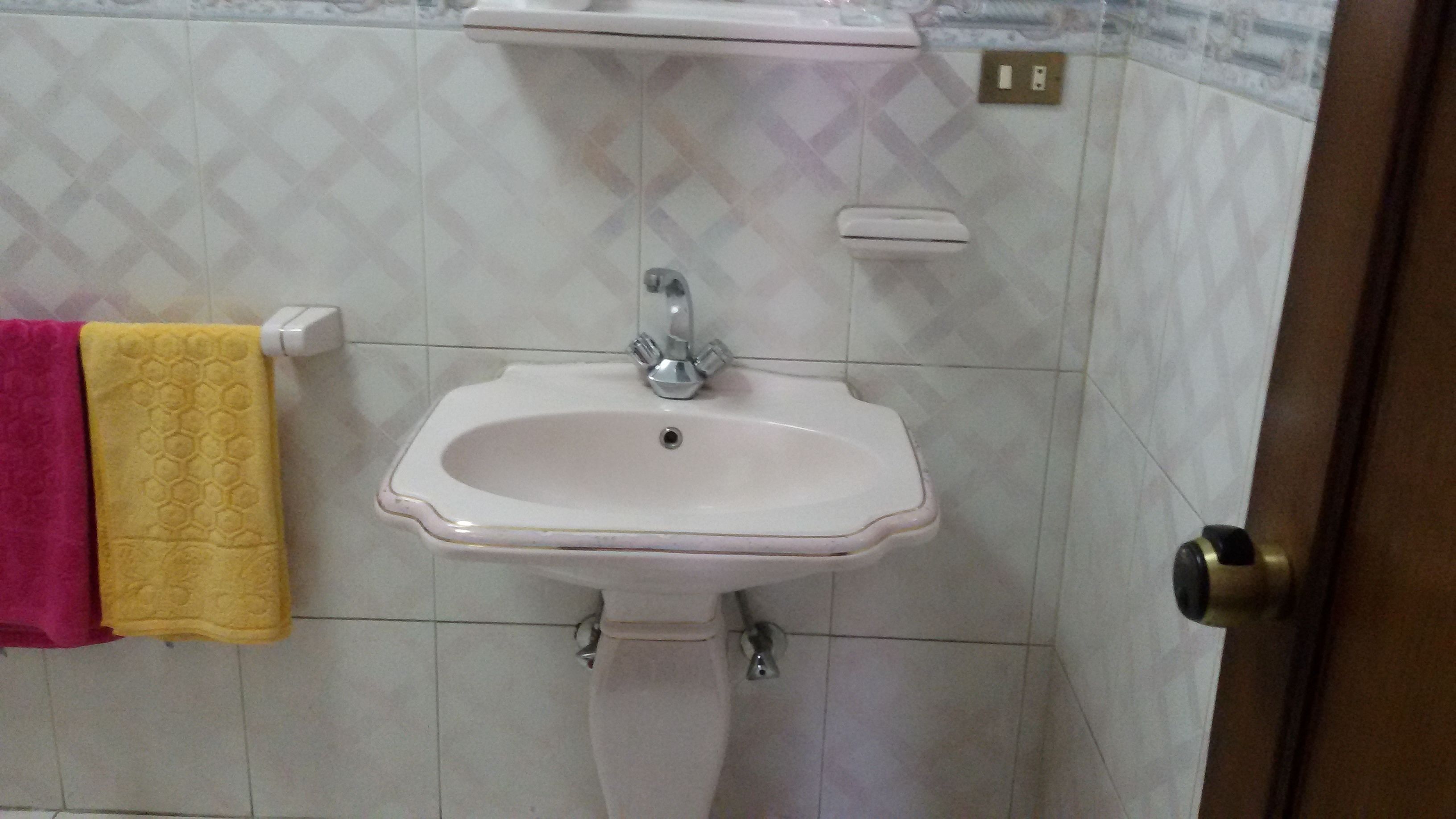 double room, river view | bathroom sink