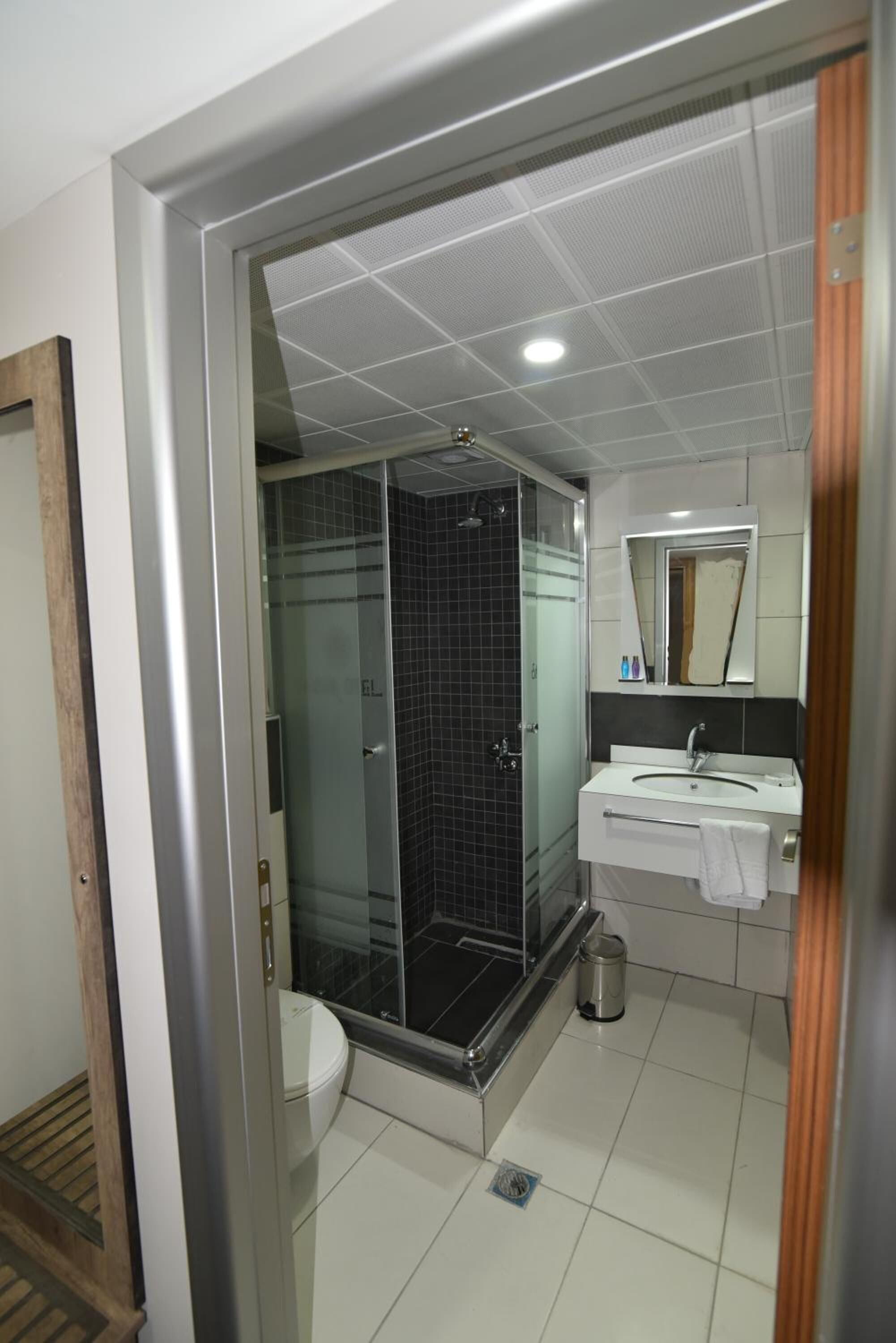 Shower, free toiletries, hair dryer, slippers