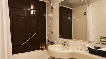 Combined shower/tub, free toiletries, hair dryer, slippers