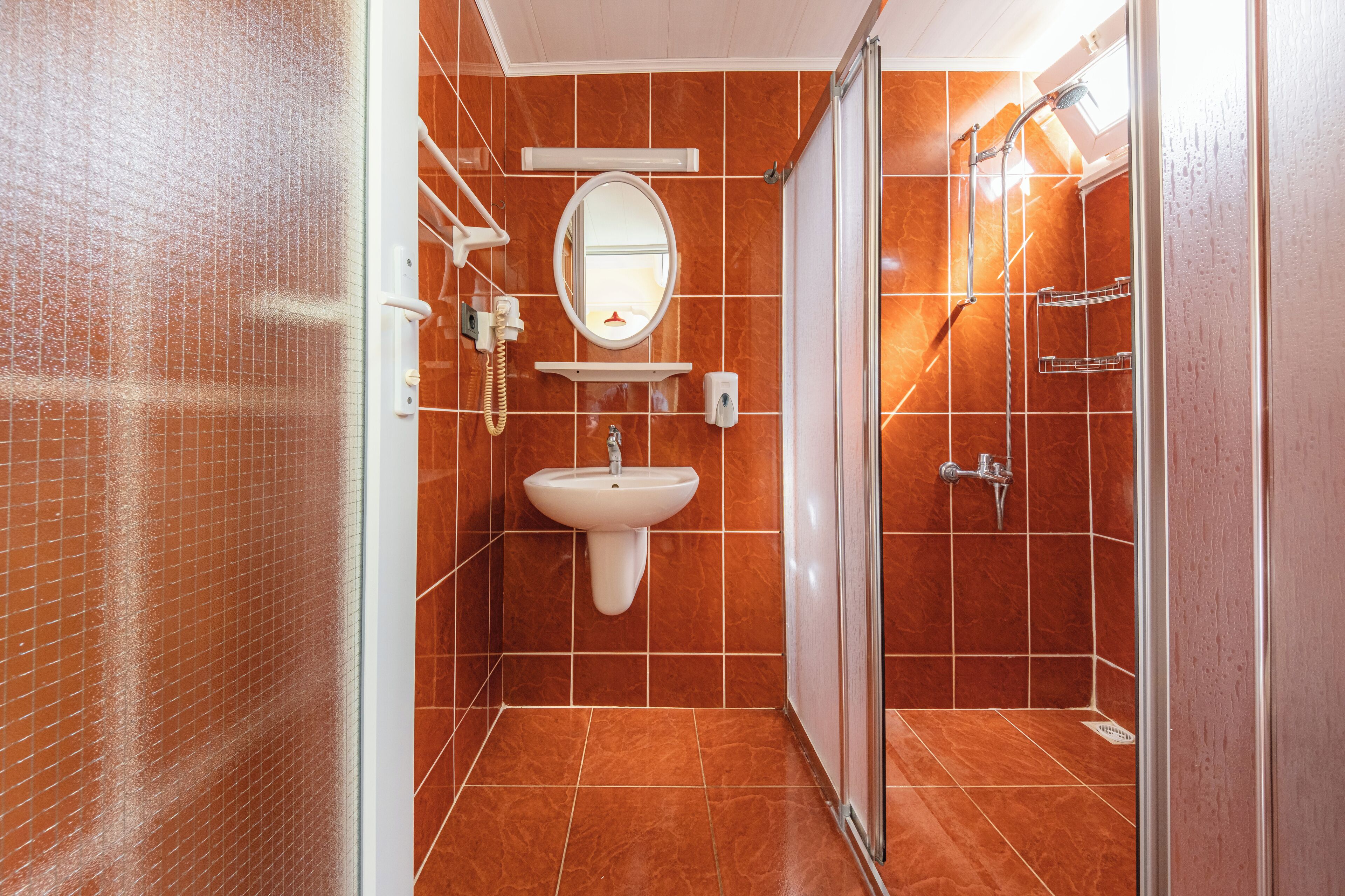 apartment, garden view | bathroom | shower, free toiletries, hair dryer, slippers