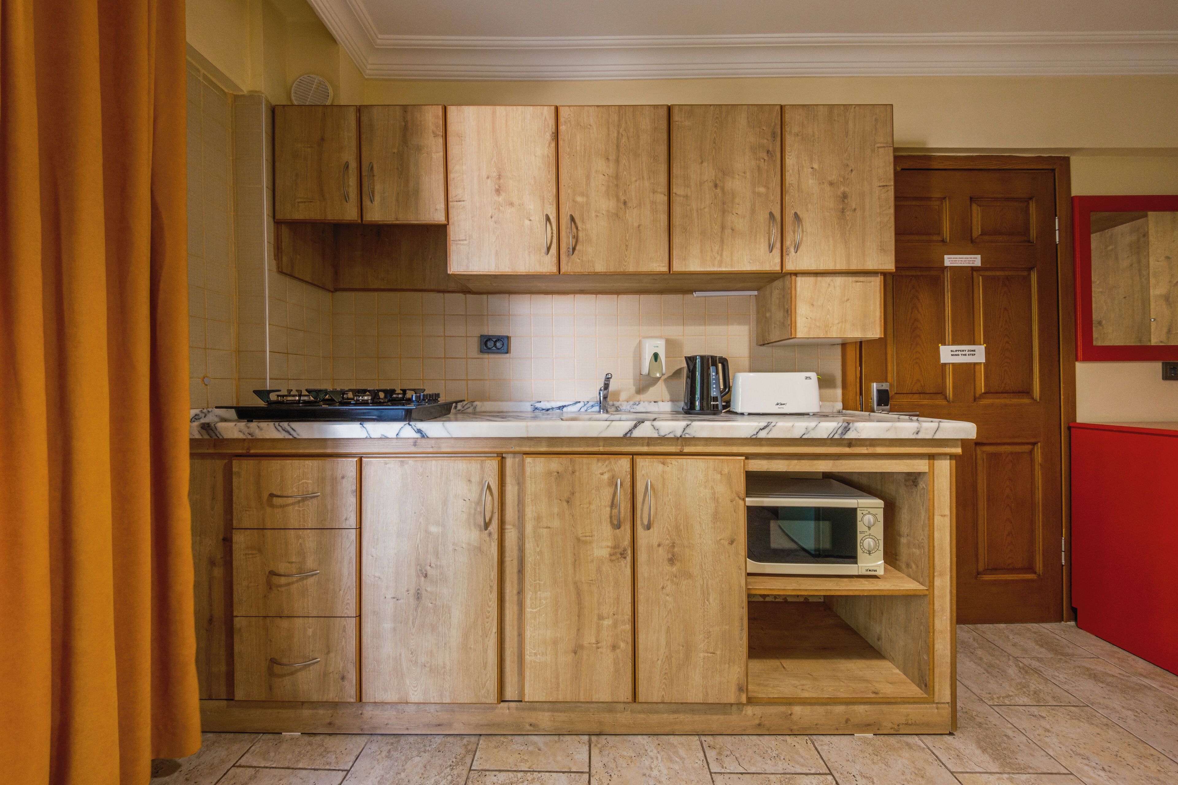 family apartment | private kitchen | fridge, cleaning supplies