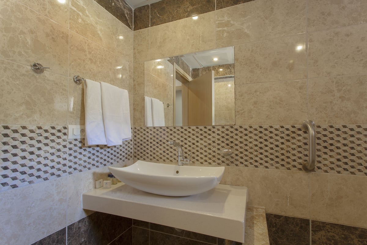 family room | 1 bedroom, premium bedding, minibar, in-room safe