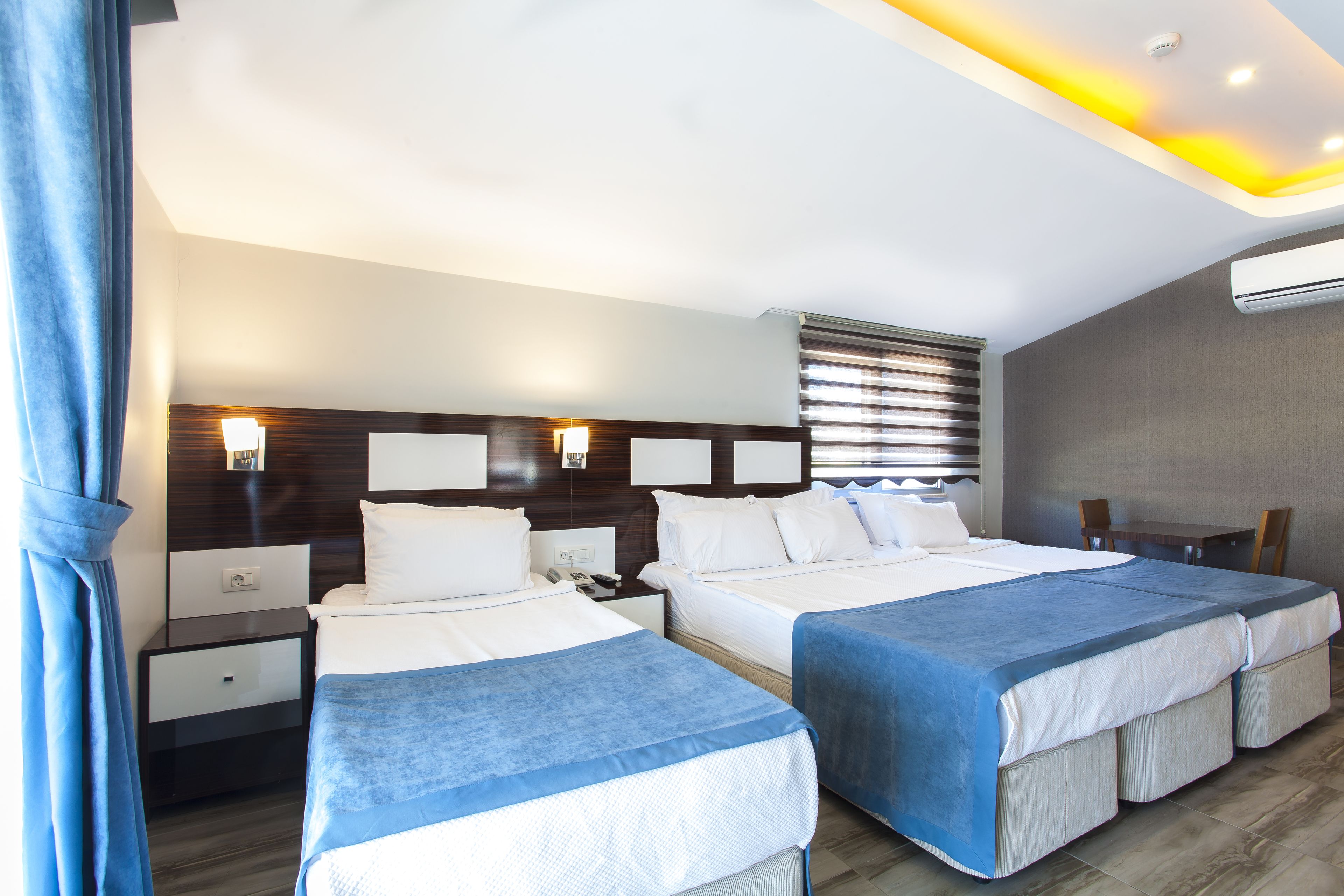family room | 1 bedroom, premium bedding, minibar, in-room safe