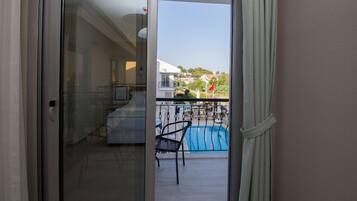 Comfort Double Room, Pool View | 1 bedroom, in-room safe, desk, iron/ironing board