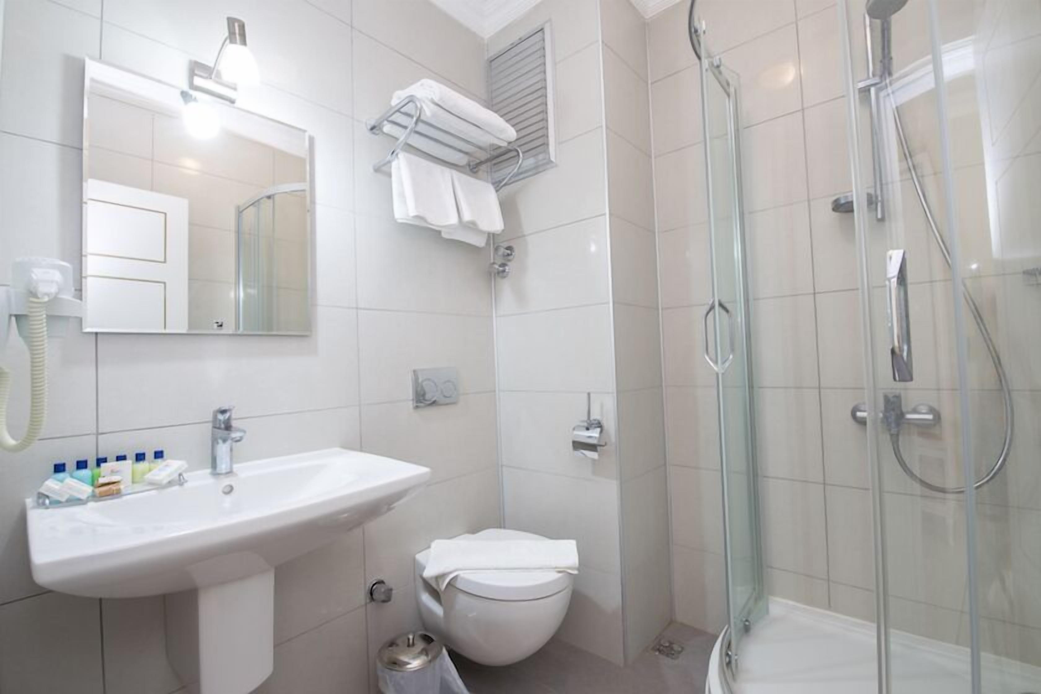 comfort double room, pool view | bathroom | shower, free toiletries, hair dryer, slippers