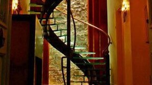 A staircase with a glass railing leading to a lower level. - Cunda Lena Otel (Ayvalik)