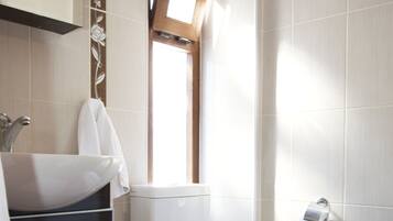 Shower, free toiletries, hair dryer, slippers