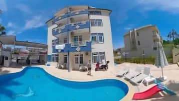 Outdoor pool, pool umbrellas, sun loungers