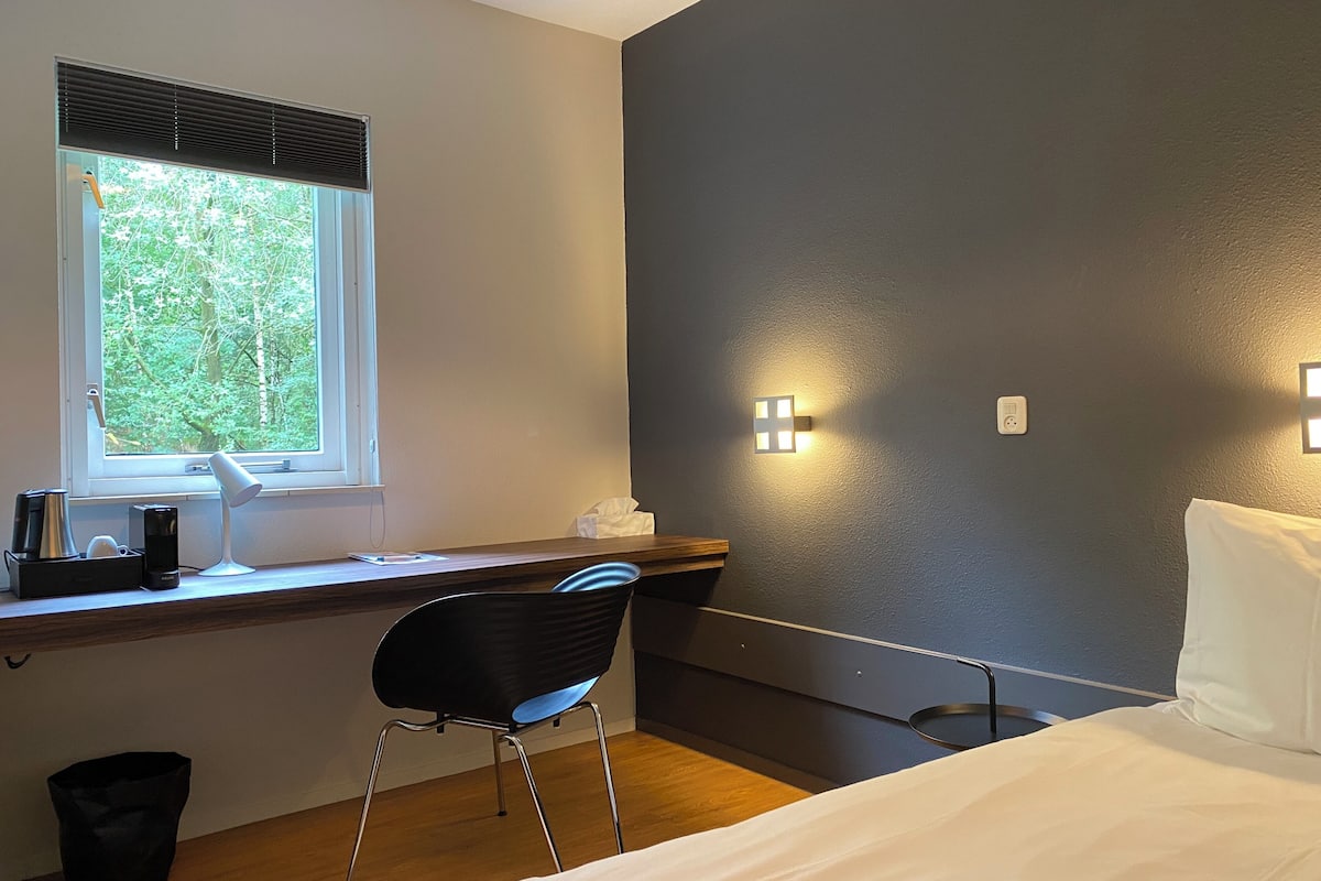 single room, 1 large single bed, garden view | blackout curtains, iron/ironing board, free wifi, bed sheets