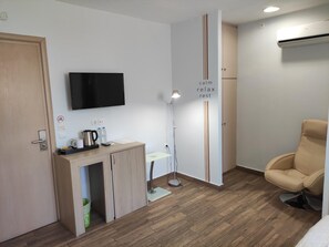 Desk, blackout curtains, soundproofing, iron/ironing board