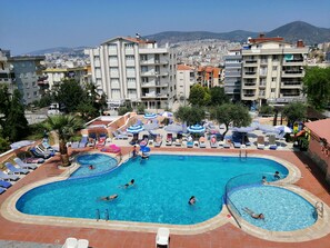 Outdoor pool, open 8:00 AM to 7:30 PM, pool umbrellas, pool loungers