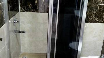 Shower, free toiletries, hair dryer, slippers