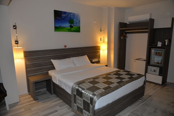 Habitación individual | Ropa de cama de alta calidad y minibar