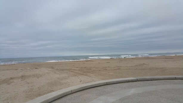 A beach with a sandy shore and waves. - 12 Ashworth Ave (Hampton)