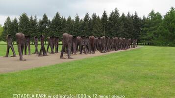 A park with a long row of elephant sculptures.