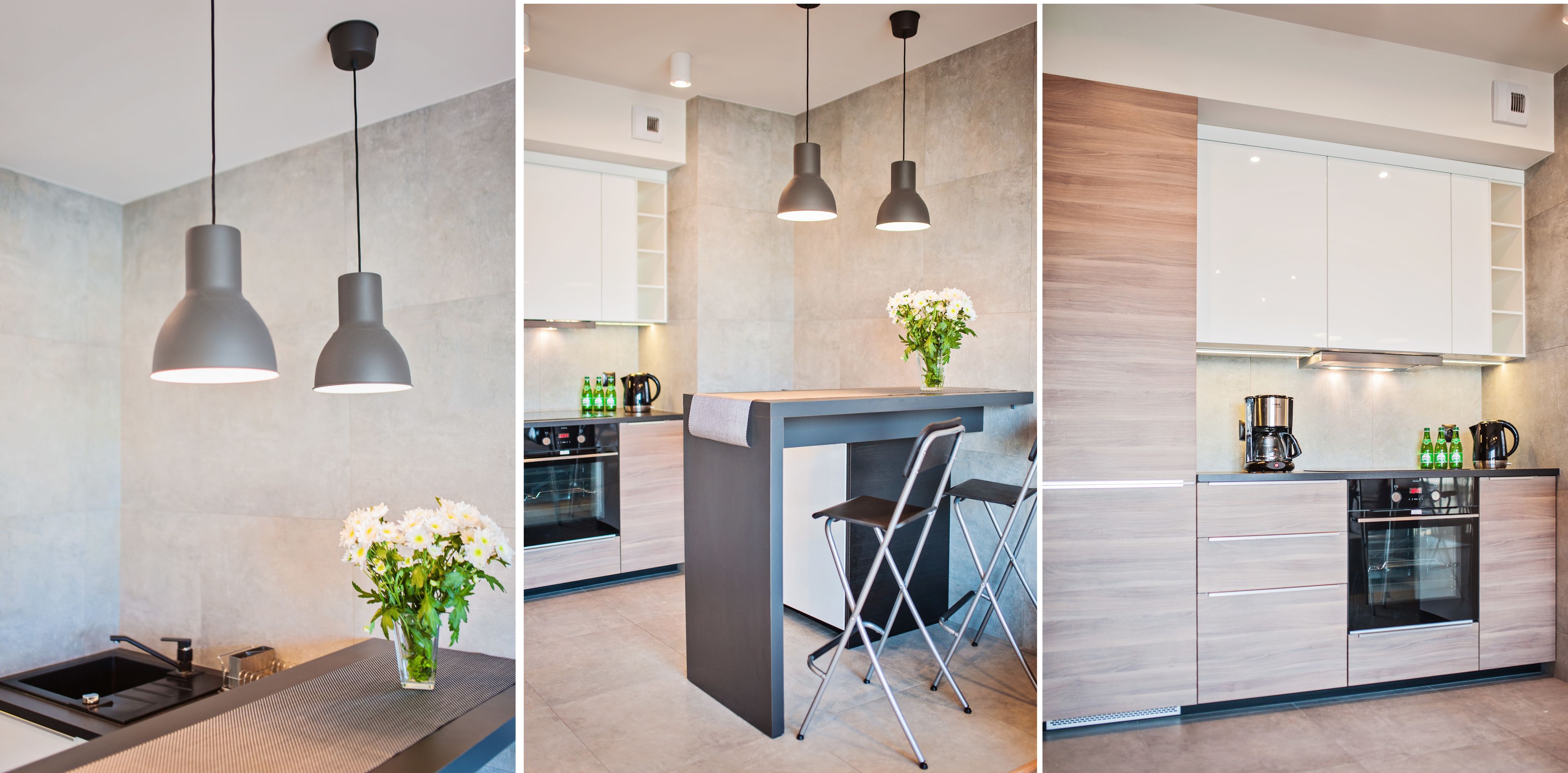 A modern kitchen with a central island, pendant lighting, and a built-in oven.