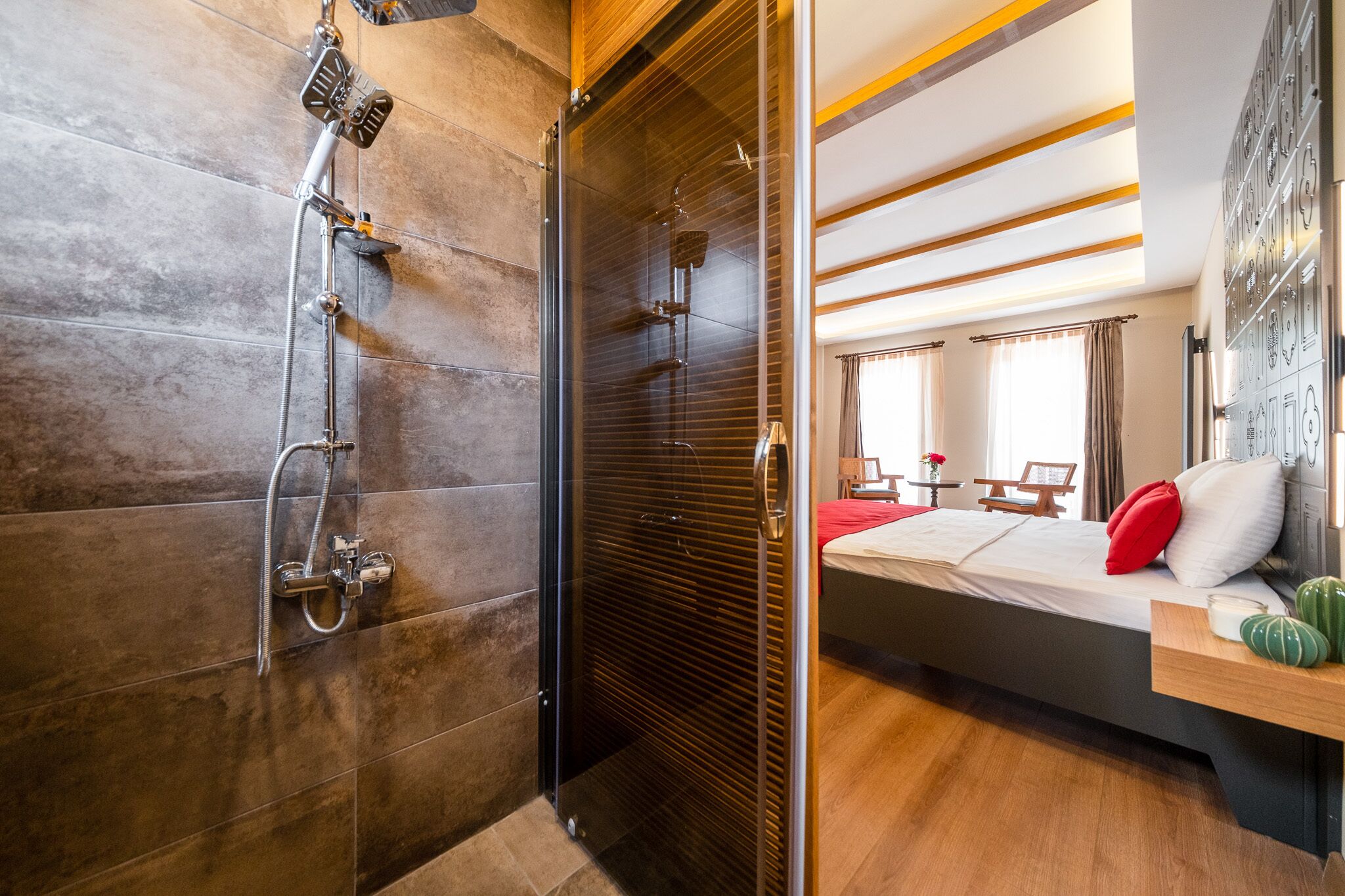 deluxe double room | bathroom | shower, rainfall showerhead, hair dryer, slippers