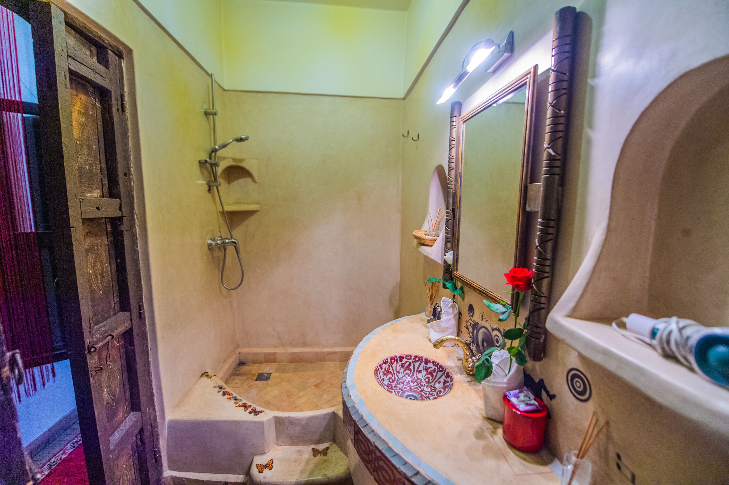 A bathroom with a bathtub, a sink, and a shower.