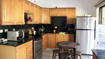 Comfort Villa, 2 Bedrooms, Pool View, Beachfront | Private kitchen | Full-sized fridge, microwave, oven, stovetop
