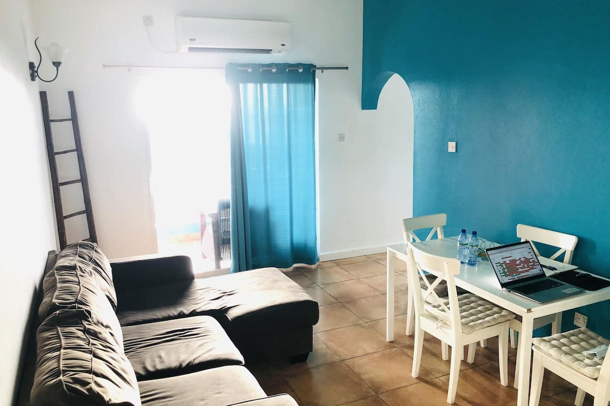 apartment, 2 bedrooms, kitchen, sea view | living room | 36-inch flat-screen tv with cable channels